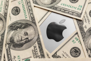 Apple icon surrounded by hundred dollar bills (cash).